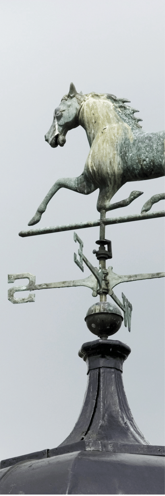 Galloping Horse, heading south, on a weather vane located on a stud farm rooftop  Plenty of copy space 