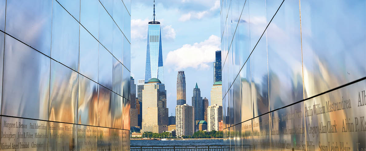 Jersey City, NJ, USA - July 27, 2023: Empty Sky Memorial commemorating the New Jersey victims of September 11 with One World Trade Center (Freedom Tower) in background